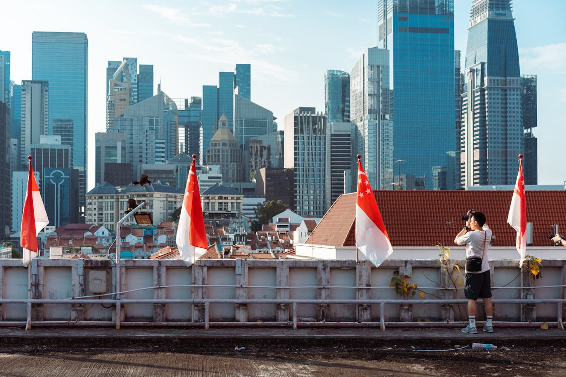 Singapore Skyline with Flags and Photographer